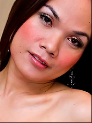 Lovely ladyboy Beer in a white gown and red undies